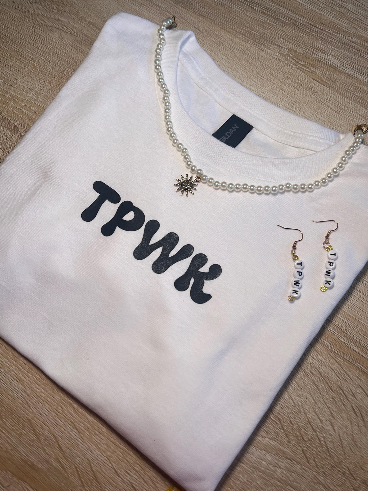 tpwk baby tee shirt. gift ideas. gifts for her. women’s crewneck. Christmas. holiday shopping. gifts for women. Girl gifts