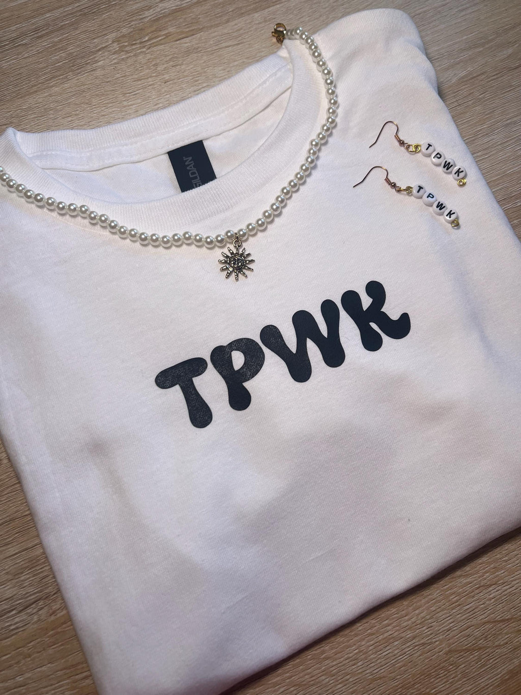 tpwk baby tee shirt. gift ideas. gifts for her. women’s crewneck. Christmas. holiday shopping. gifts for women. Girl gifts
