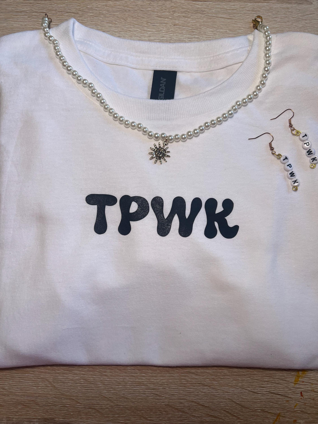 tpwk baby tee shirt. gift ideas. gifts for her. women’s crewneck. Christmas. holiday shopping. gifts for women. Girl gifts