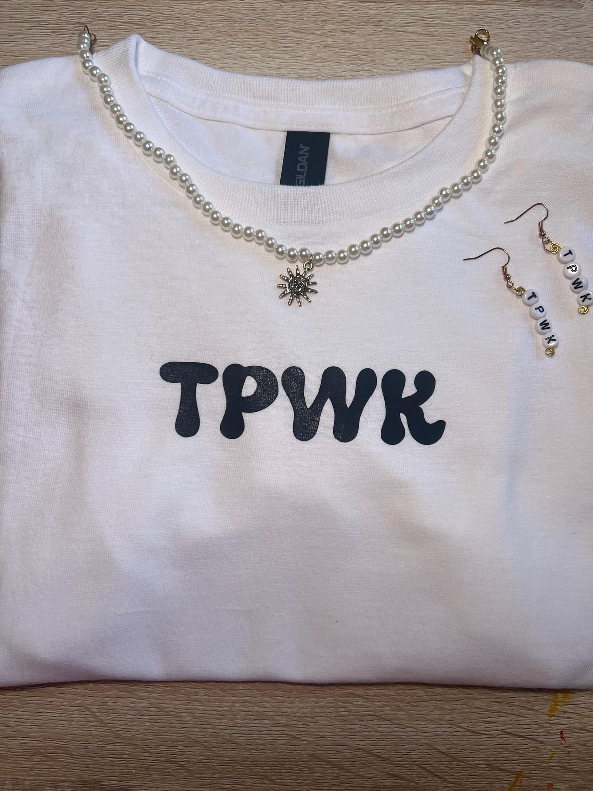 tpwk baby tee shirt. gift ideas. gifts for her. women’s crewneck. Christmas. holiday shopping. gifts for women. Girl gifts