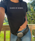 raised by Kesha baby tee. Raised by Kesha shirt. Kesha shirt. Girl shirt. hot girl baby tee. Kesha girl. Kesha fan. Cute tee