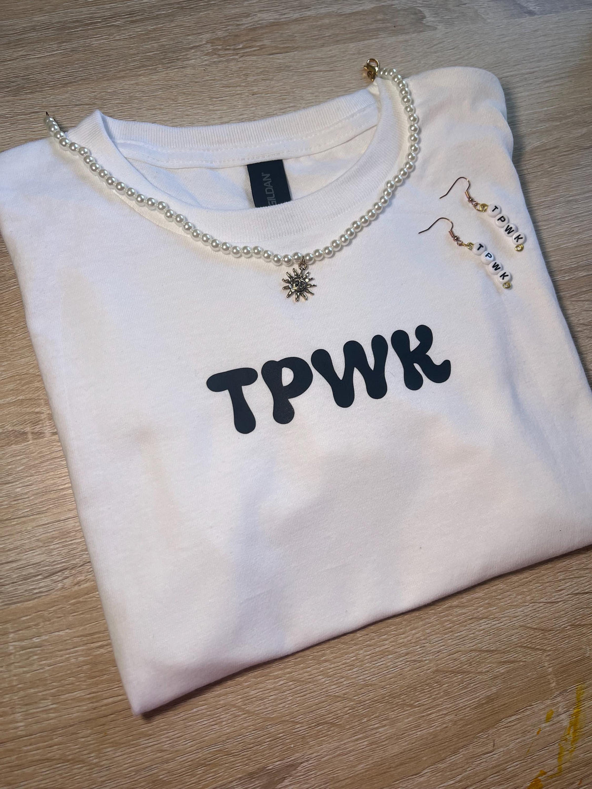 tpwk baby tee shirt. gift ideas. gifts for her. women’s crewneck. Christmas. holiday shopping. gifts for women. Girl gifts
