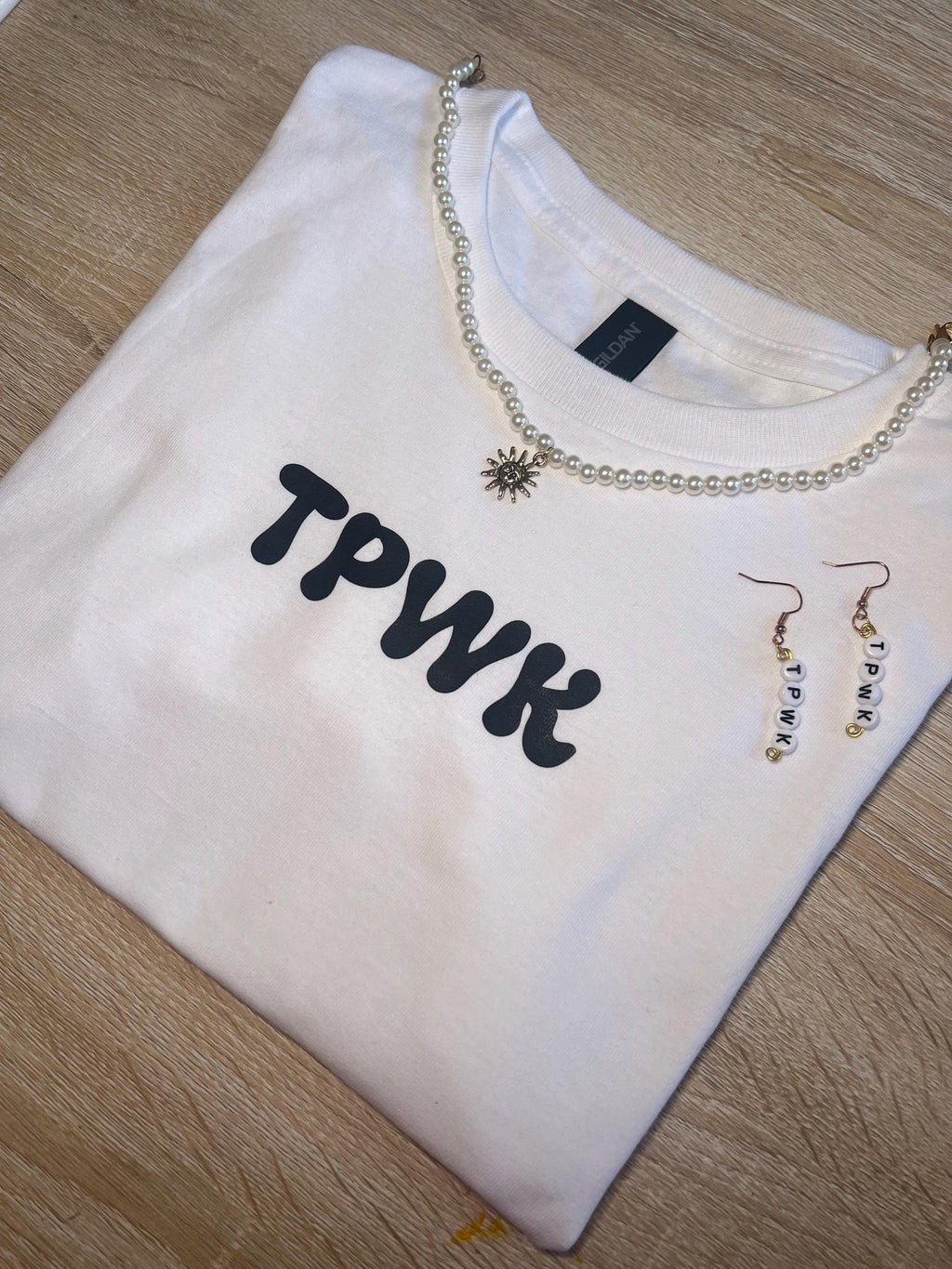 tpwk baby tee shirt. gift ideas. gifts for her. women’s crewneck. Christmas. holiday shopping. gifts for women. Girl gifts